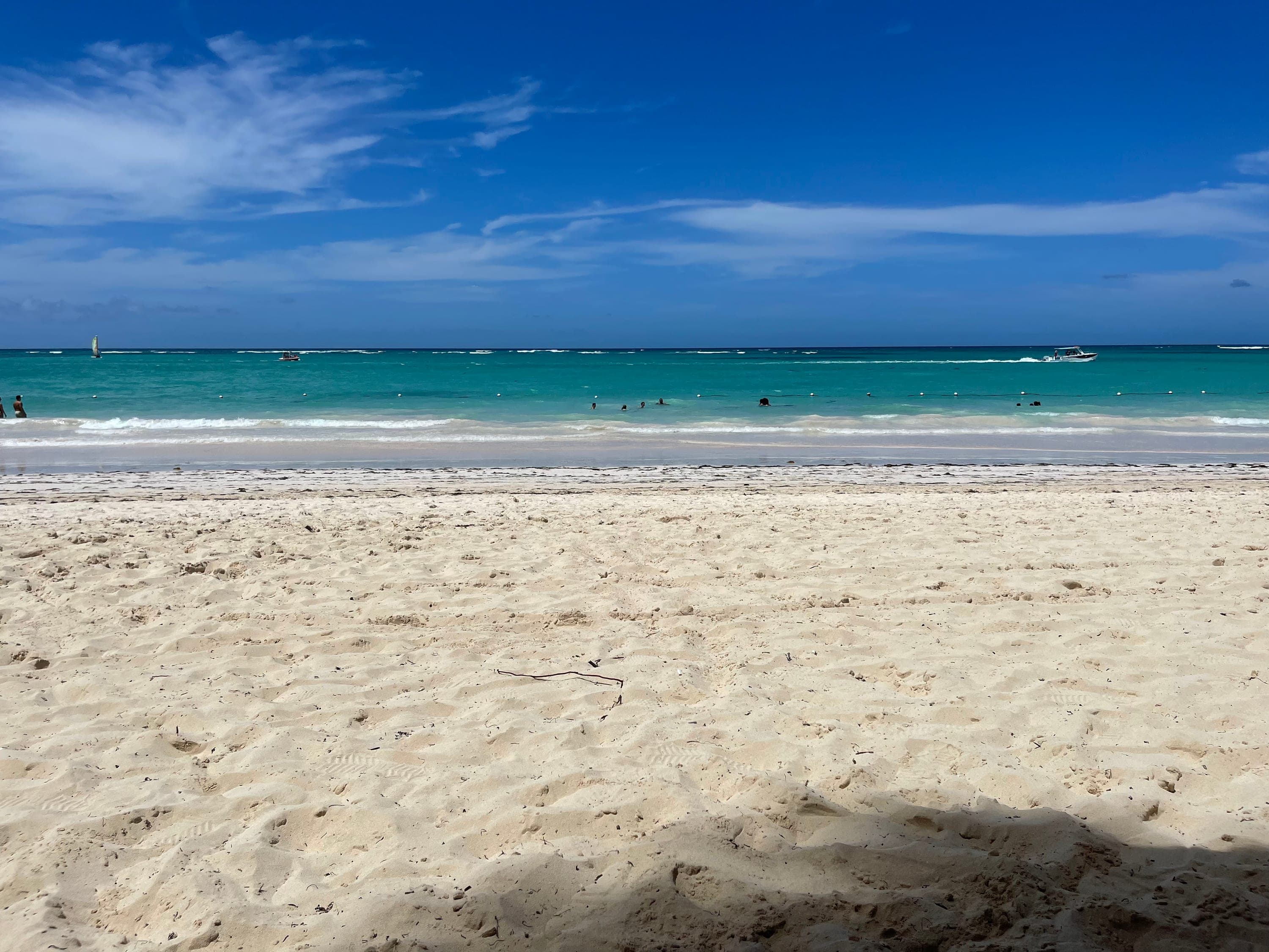 White sand and turquoise water on a Caribbean beach.